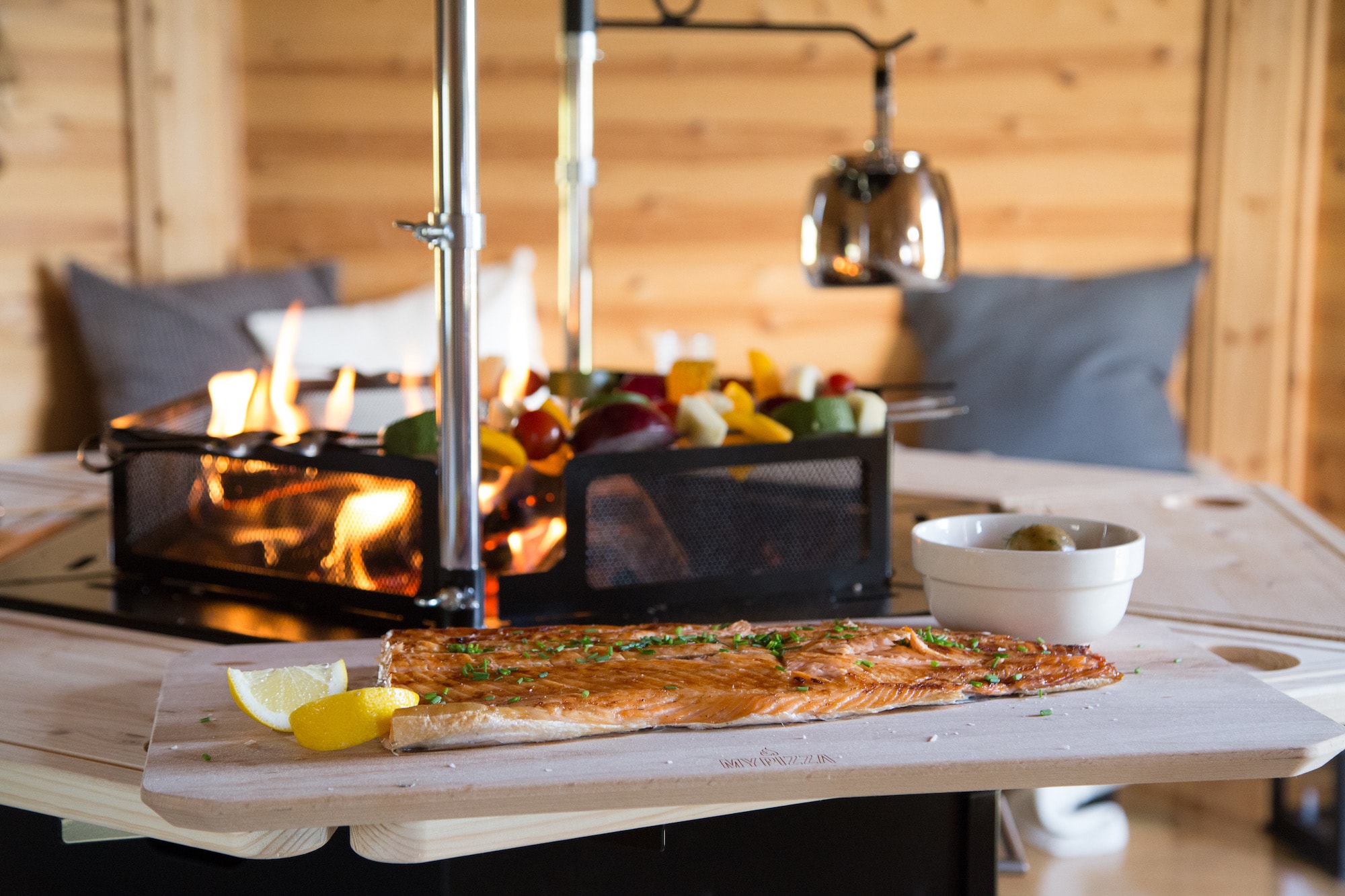 Grilled salmon over open fire at a BBQ Grill House gathering
